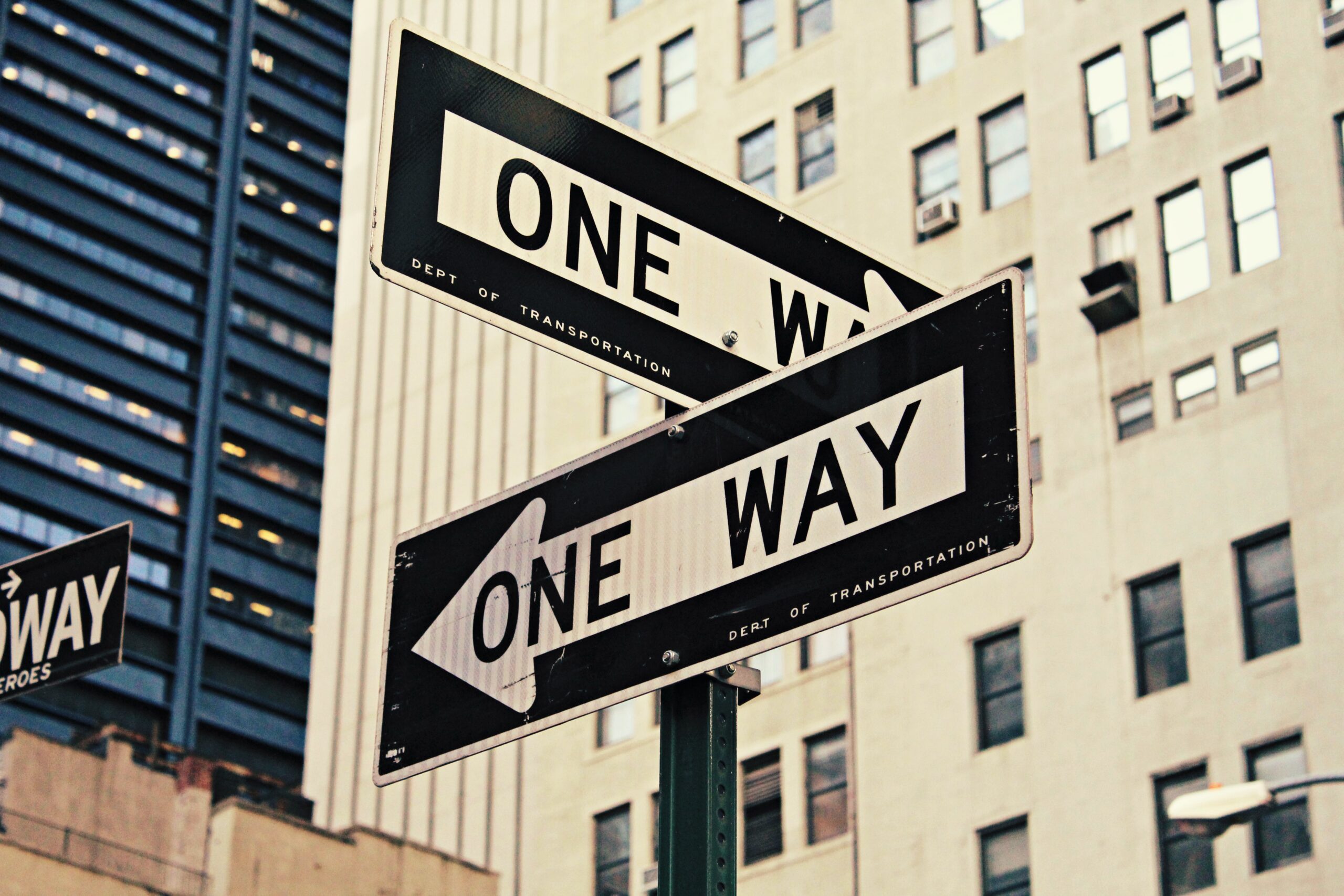 What career should I choose. One way signs pointing in the opposite direction.